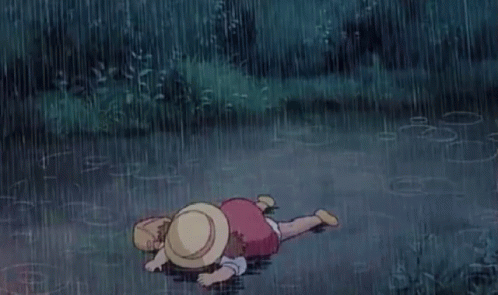 Mei from My Neighbor Totoro standing in the rain